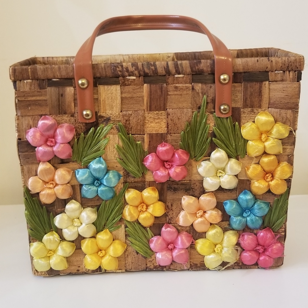 Woven handbag with colorful flower details